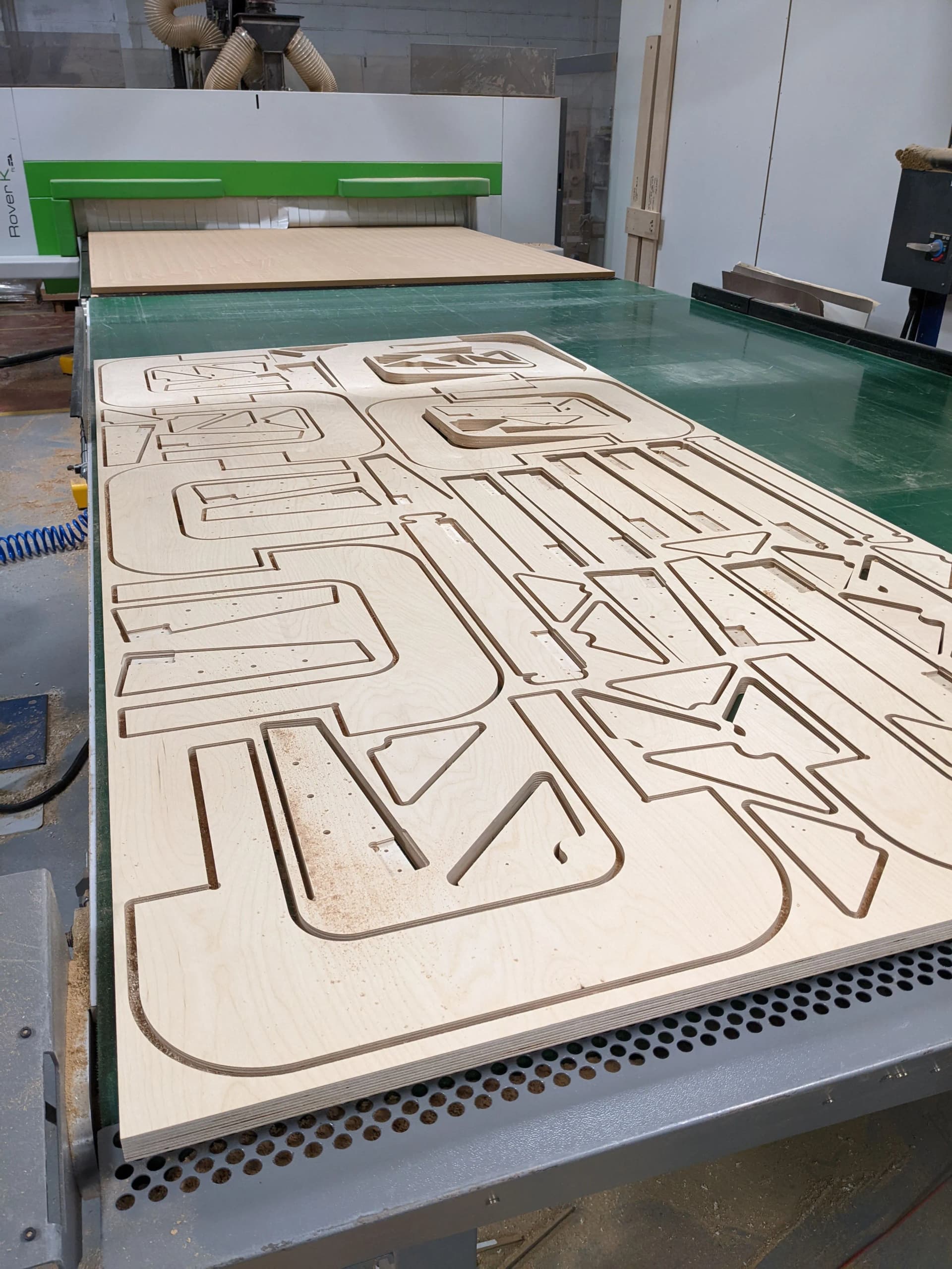 Biesse CNC router cutting complex shapes from birch plywood